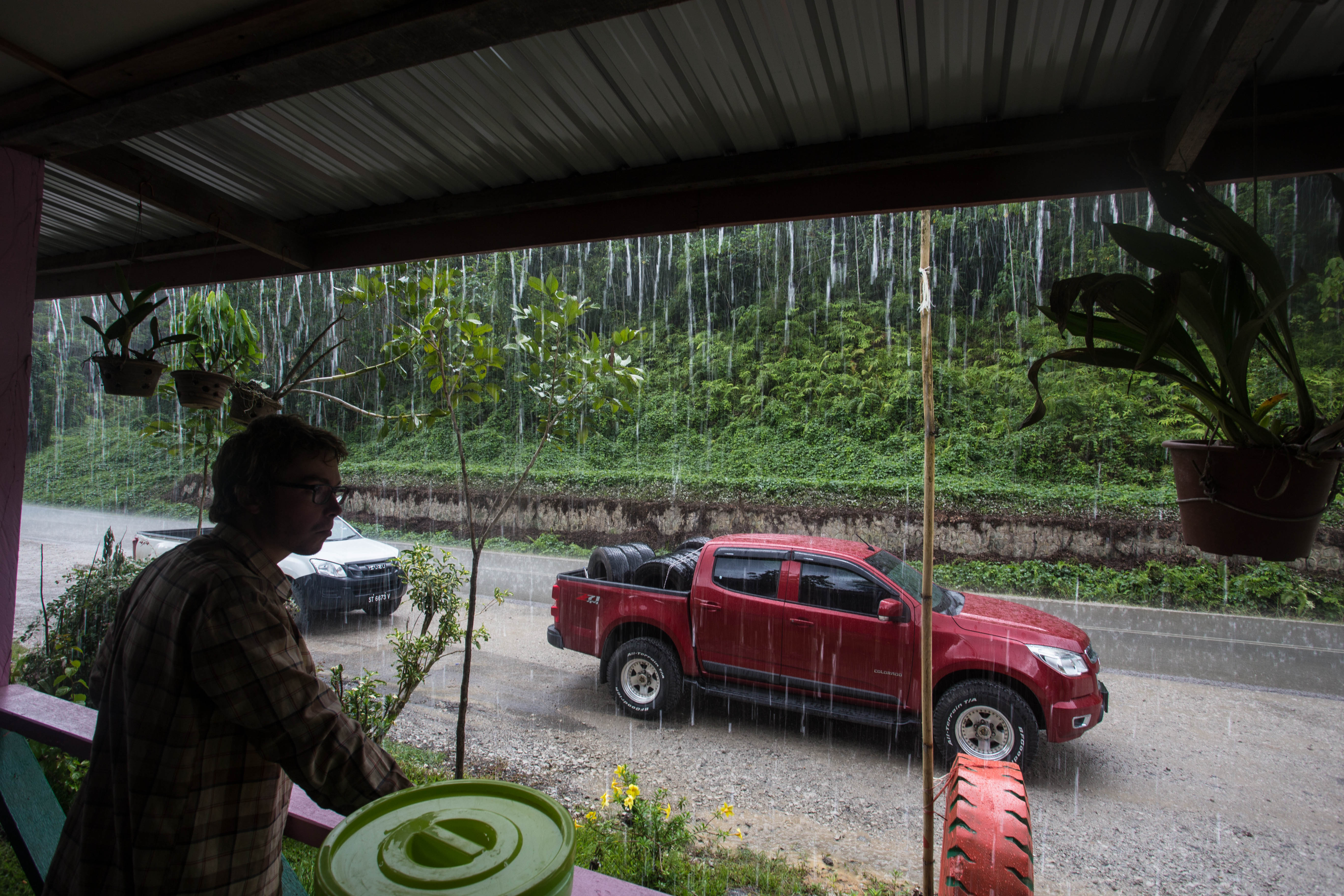 Clément surveying one of the many heavy rainstorms we usually took shelter from
