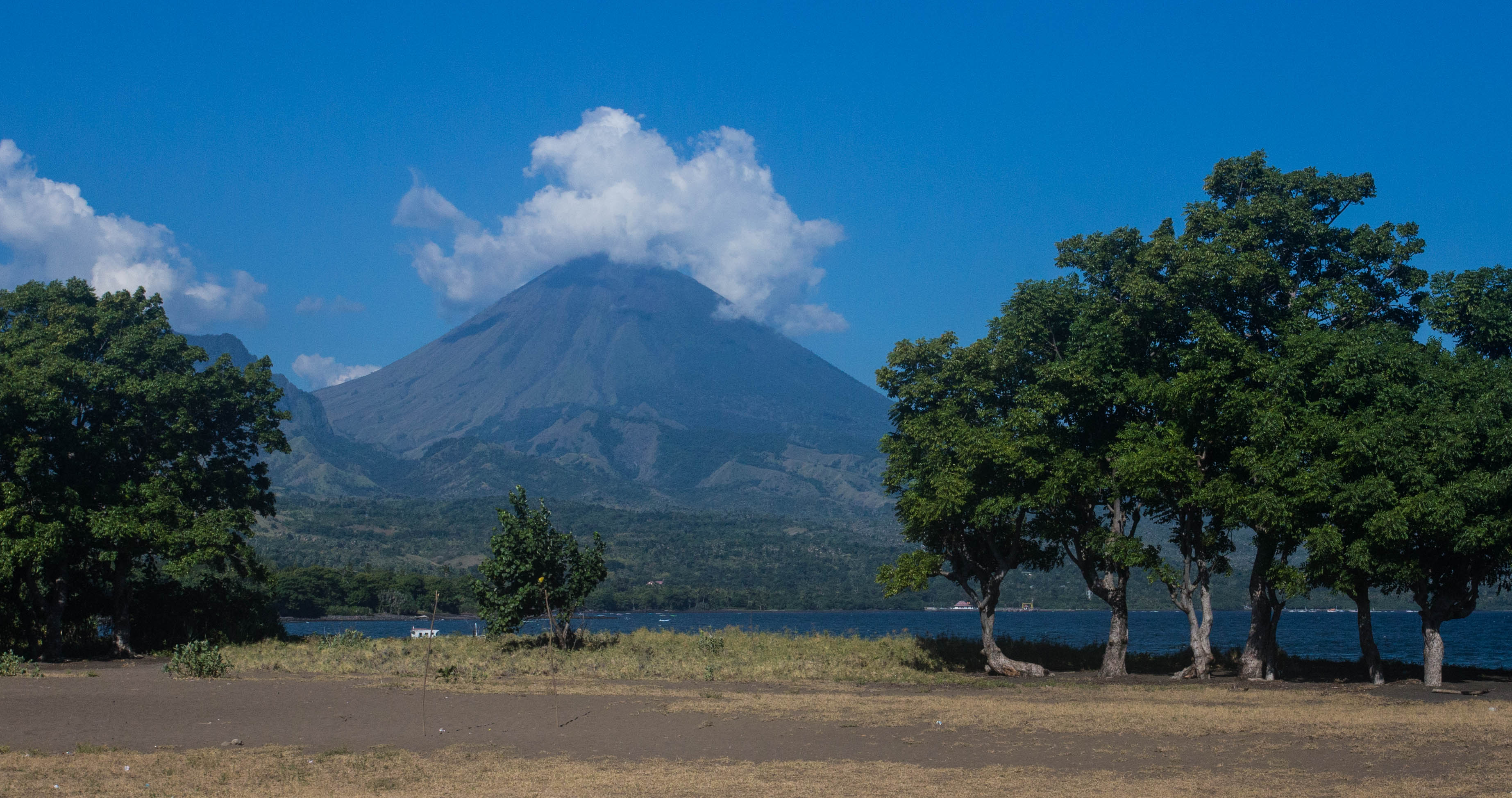 Flores was an island of towering volcanoes and stunning beaches. Pictured is the volcano of Mt.Inerie.