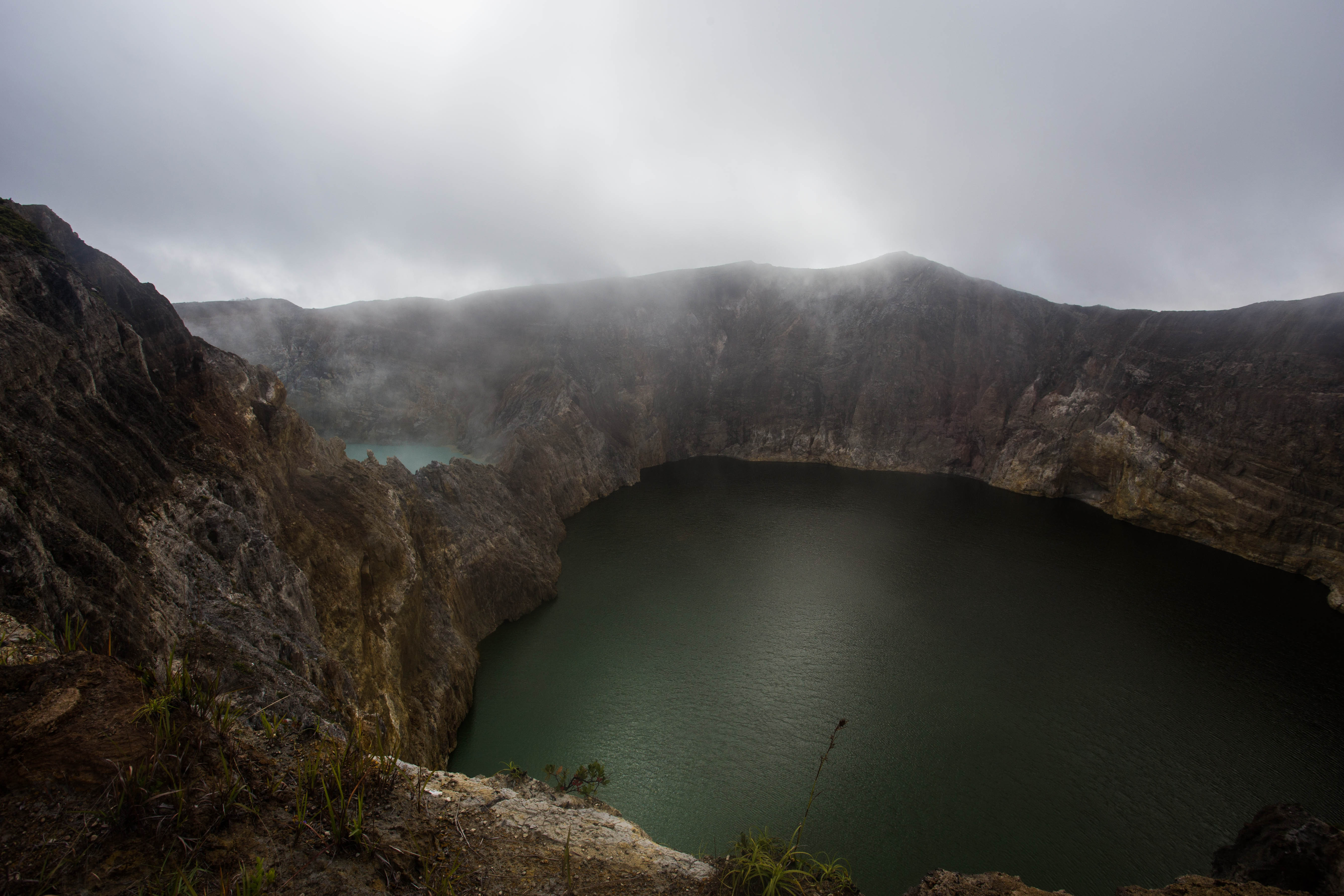 Visiting the famous multi-coloured Kelimutu crater lakes. As the clouds lifted, I was afforded this view of the two lower crater lakes.