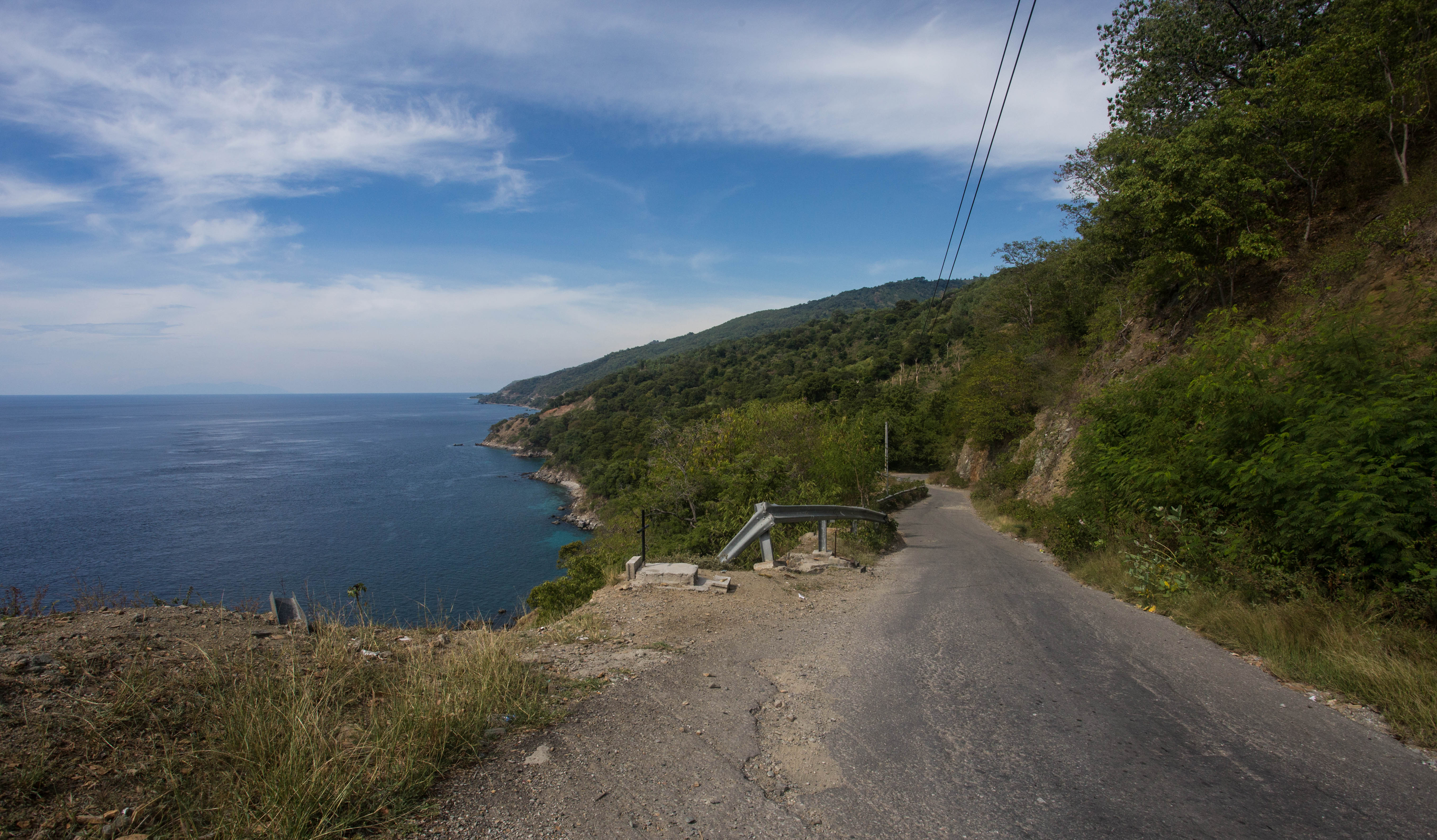 Enjoying the beautiful, narrow coast road which traversed the rugged northern coast of East Timor