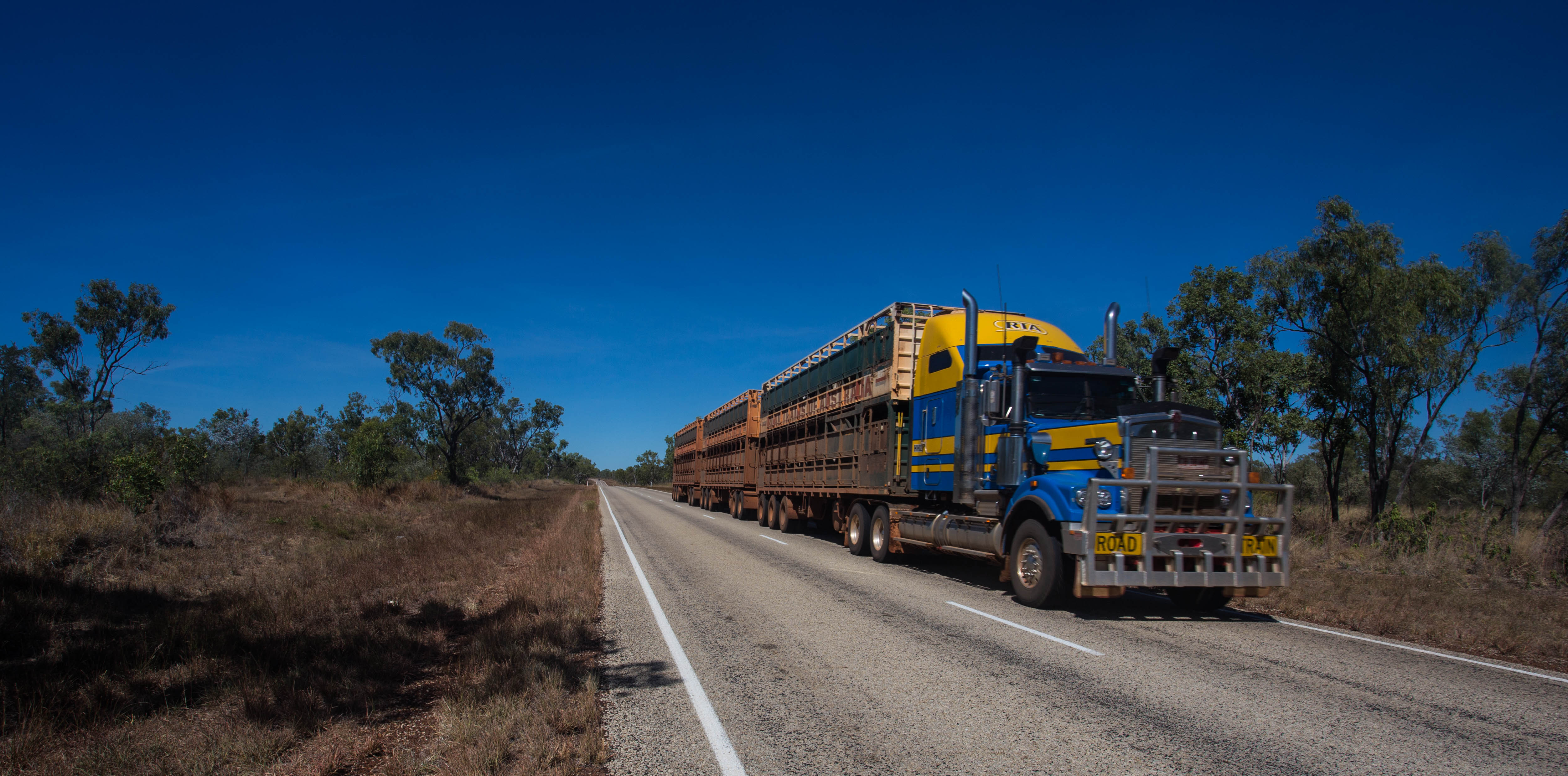The ever present three-trailer road trains, rumbling their way across the outback