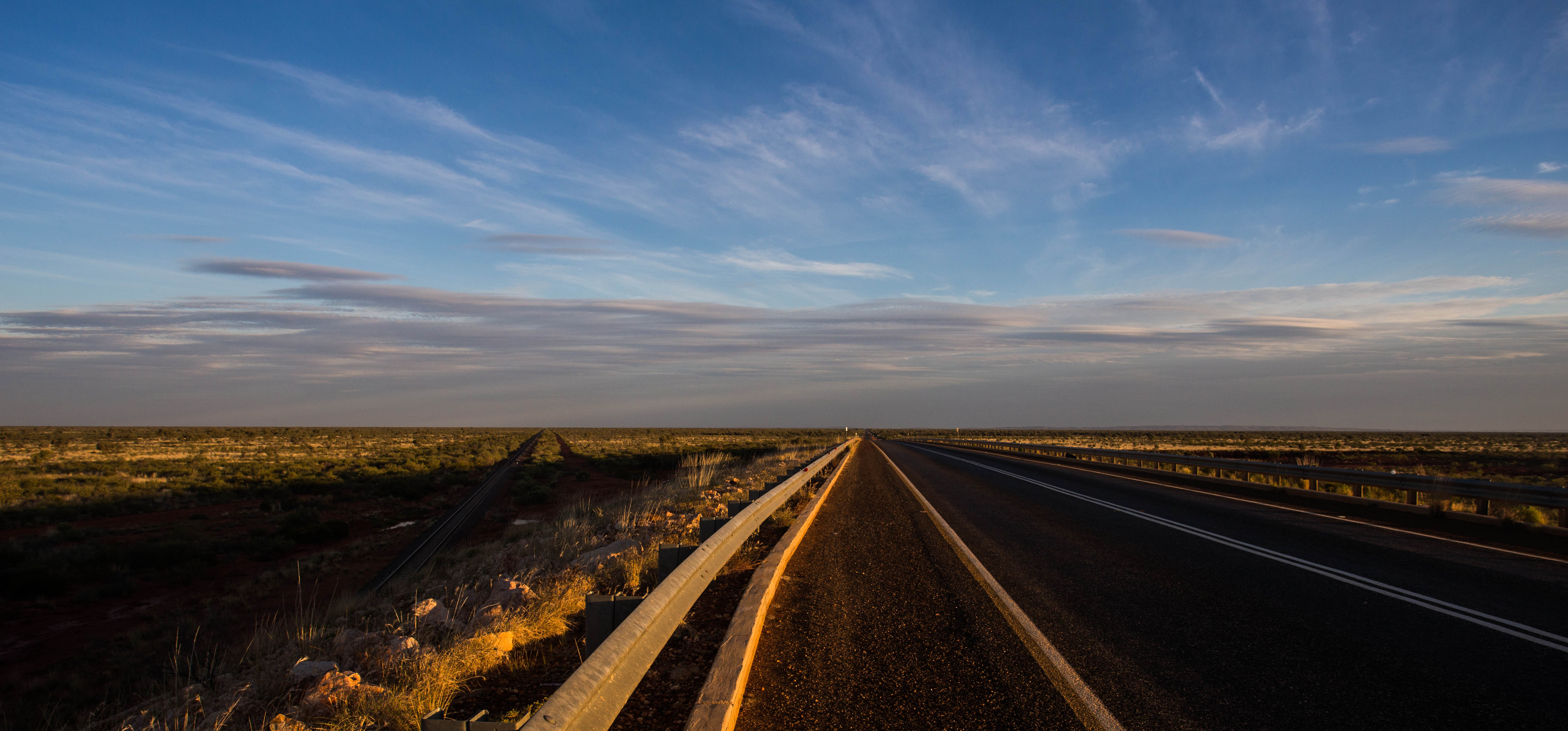 Cycling into the seemingly endless Outback during golden hour
