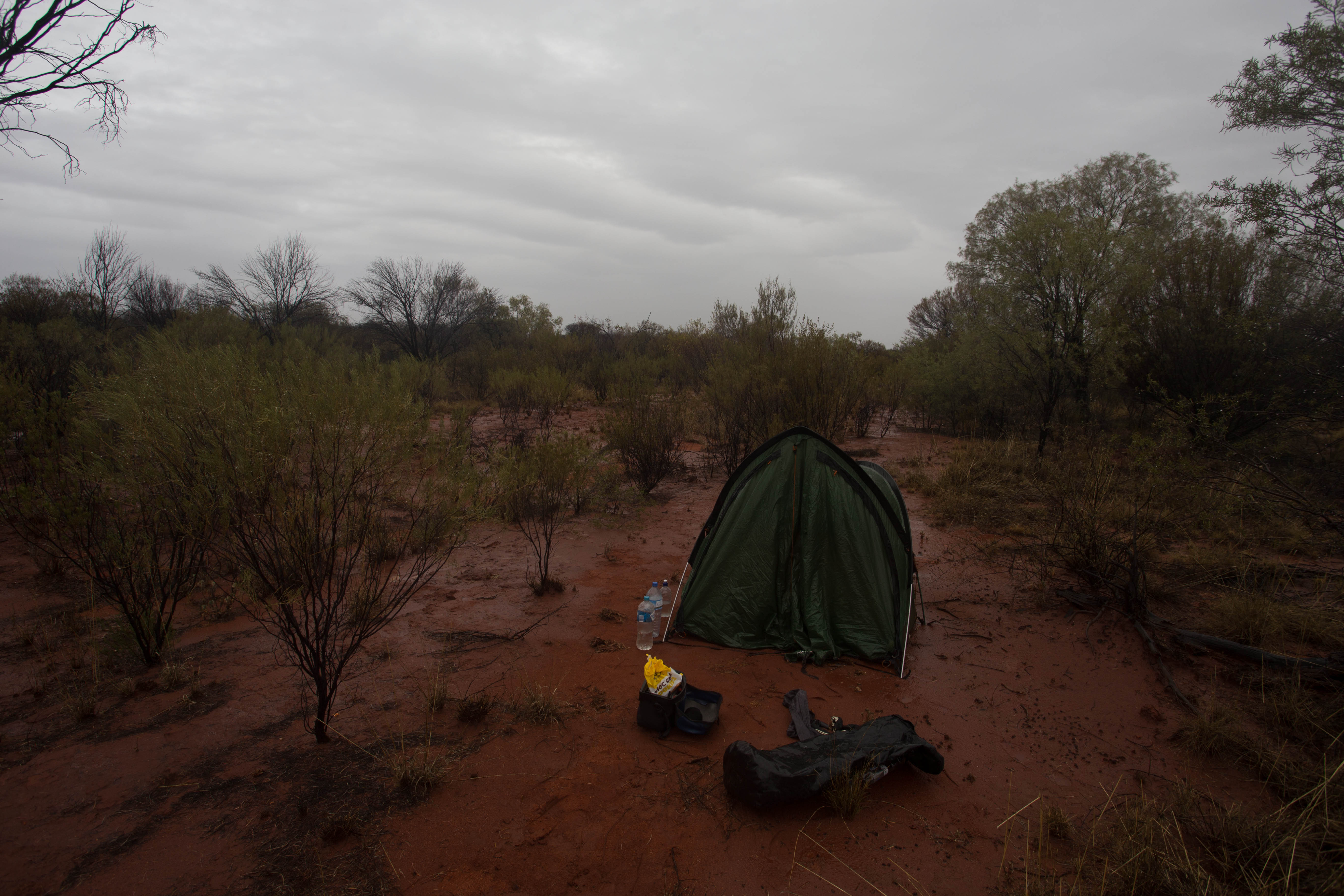 A rare overnight rain shower turning the fine red sand which had surrounded my wild camp into a deep, sticky red mud