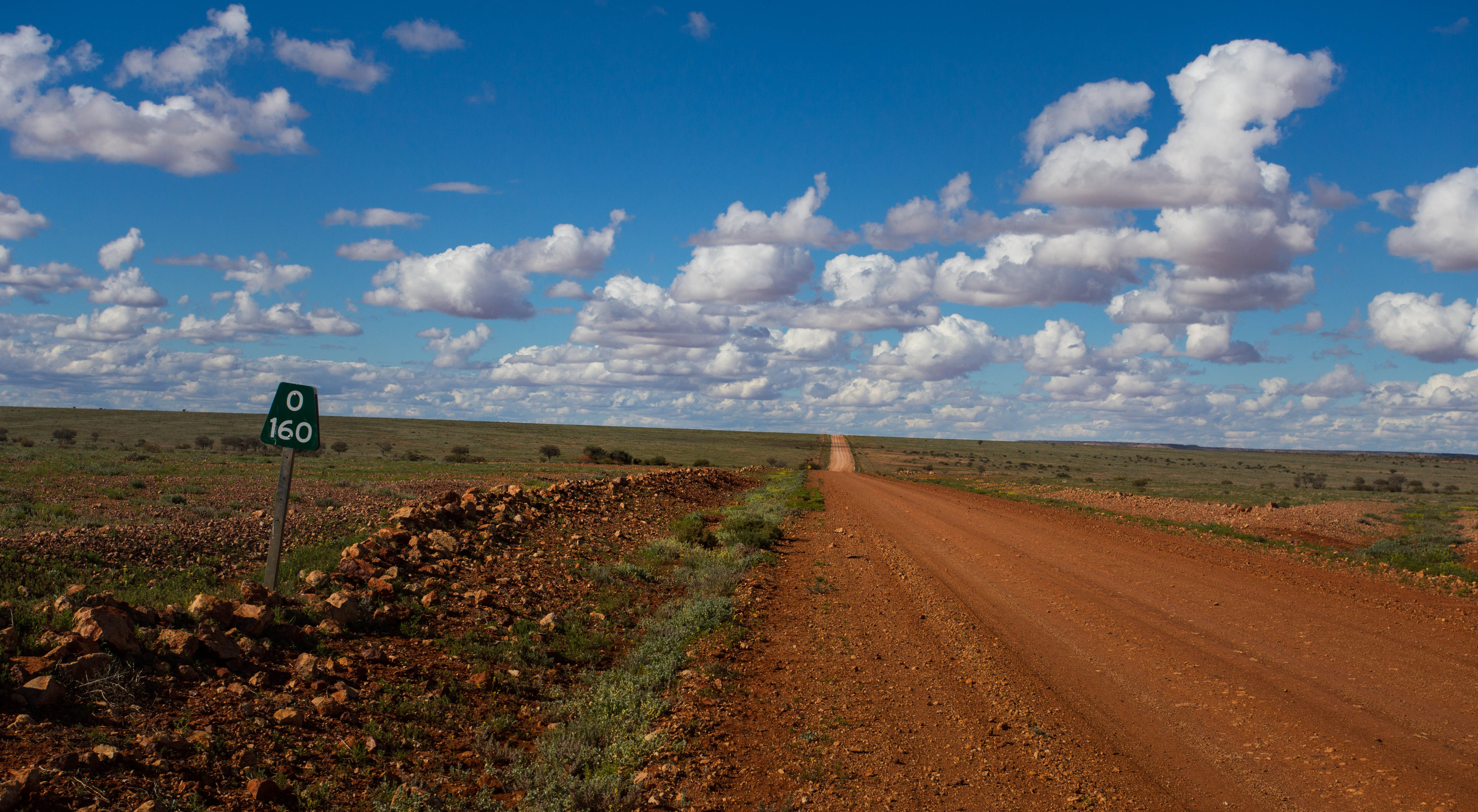 Cruising alone along the dirt of Australia's Oodnadatta Track with 160 kilometres still to go before the next settlement