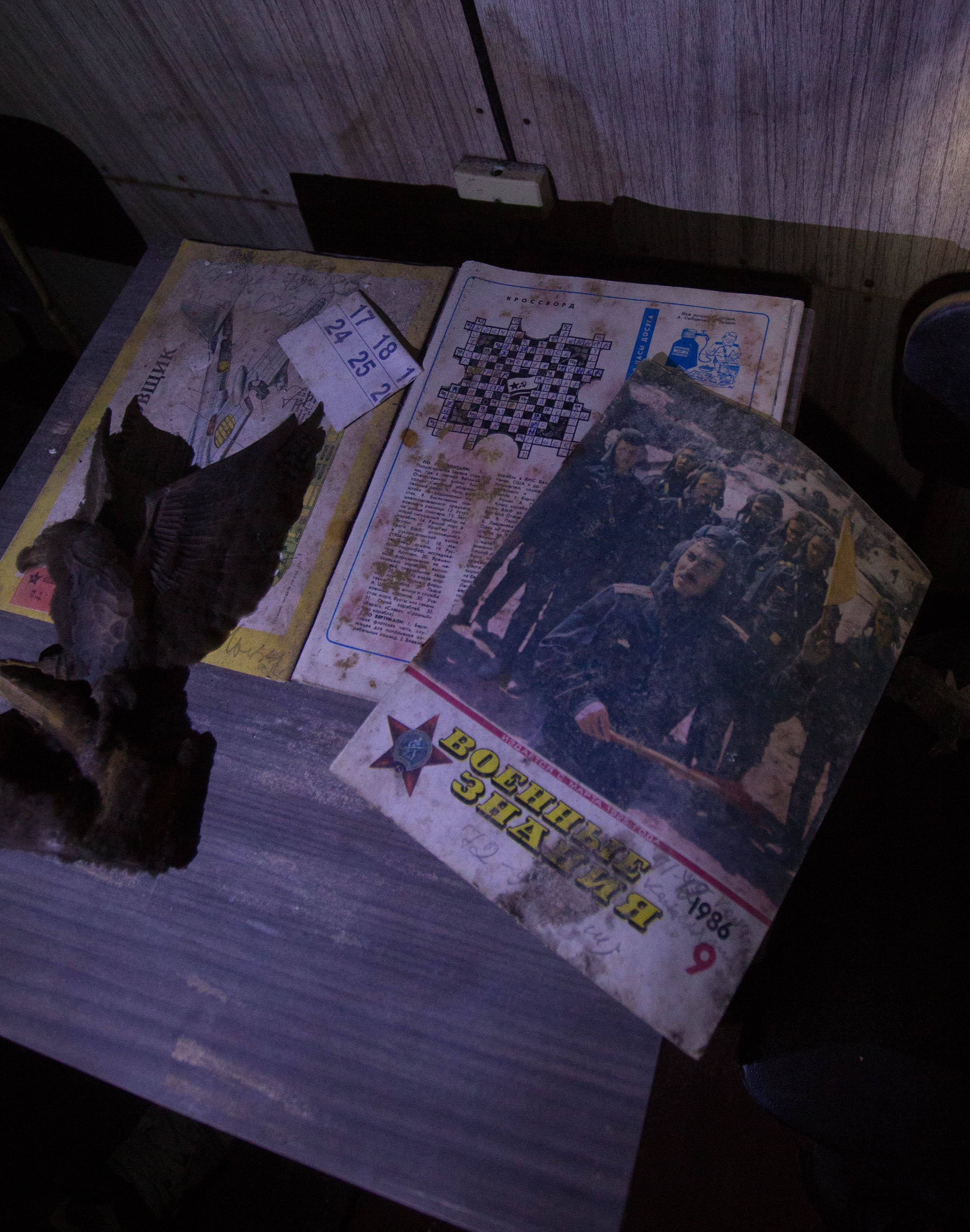 A finished crossword puzzle in an old Soviet propaganda magazine which was left sitting on a bedside locker