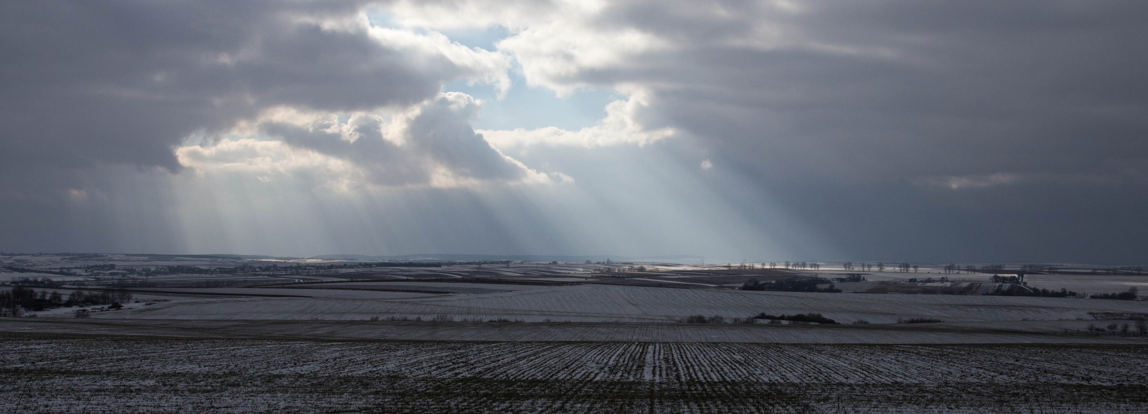 The sun shining on the snow-draped fields of south-western Ukraine