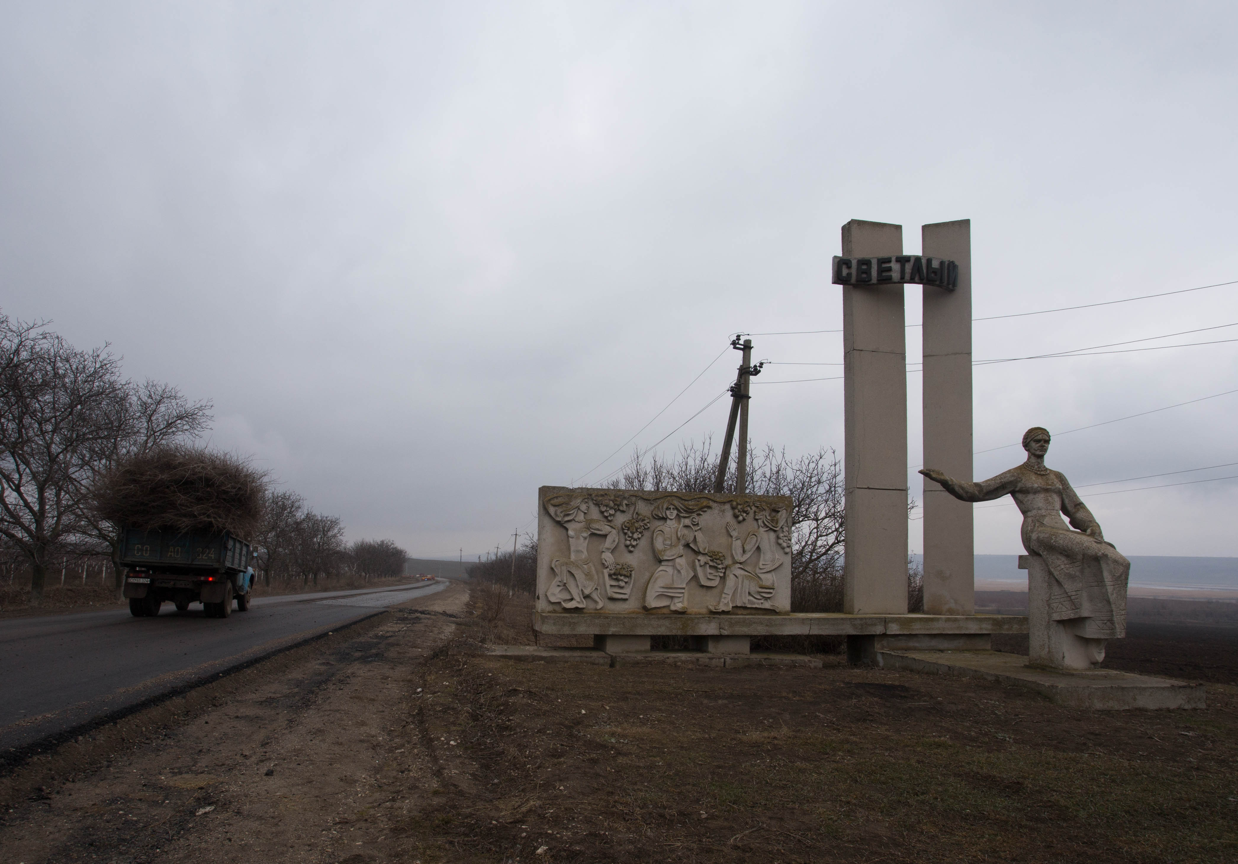 One of the many grey Soviet monuments which lined the Moldovan roadsides
