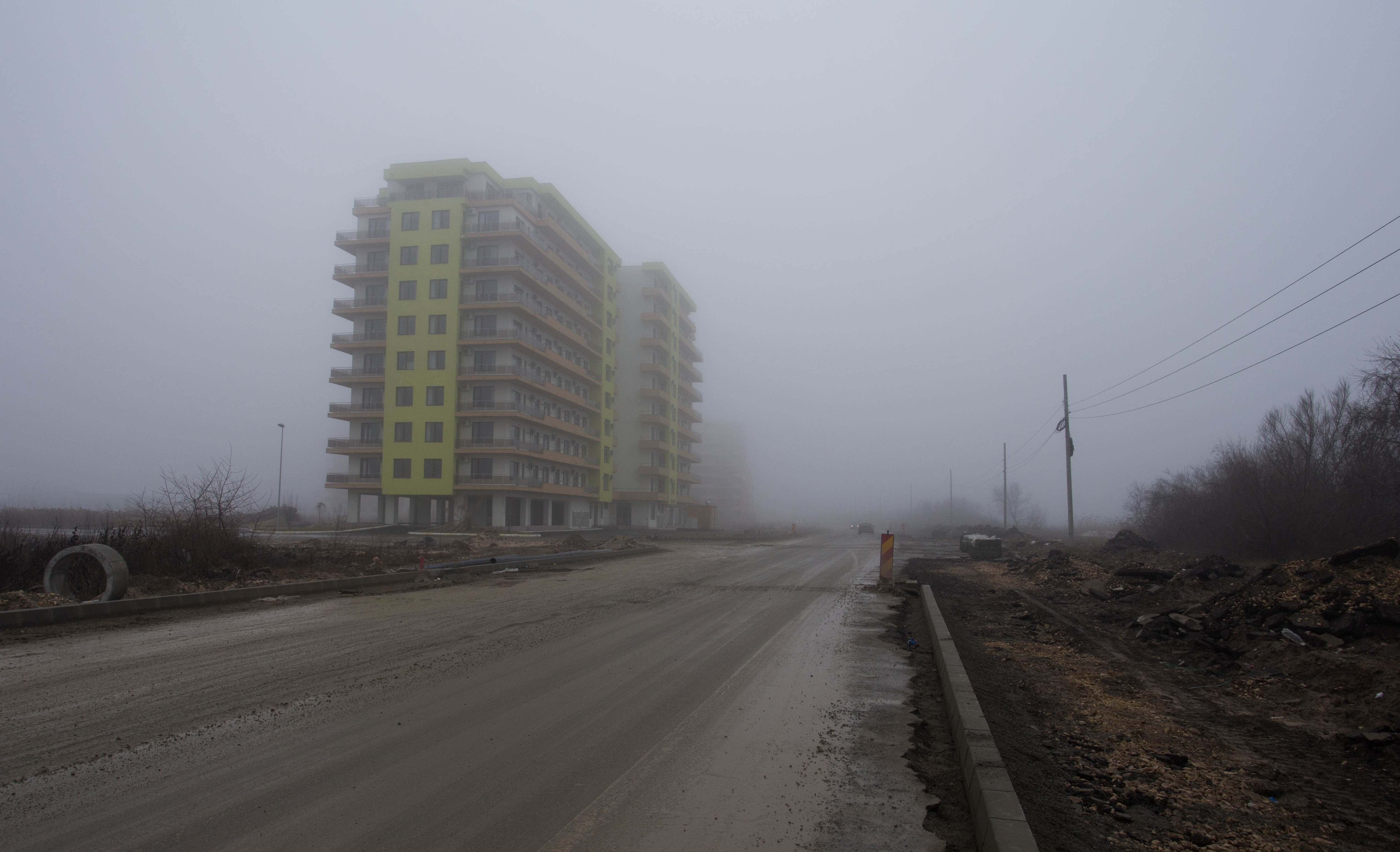 Unfinished tower blocks and construction sites materialising out of the mist as I pedalled along the Black Sea coast