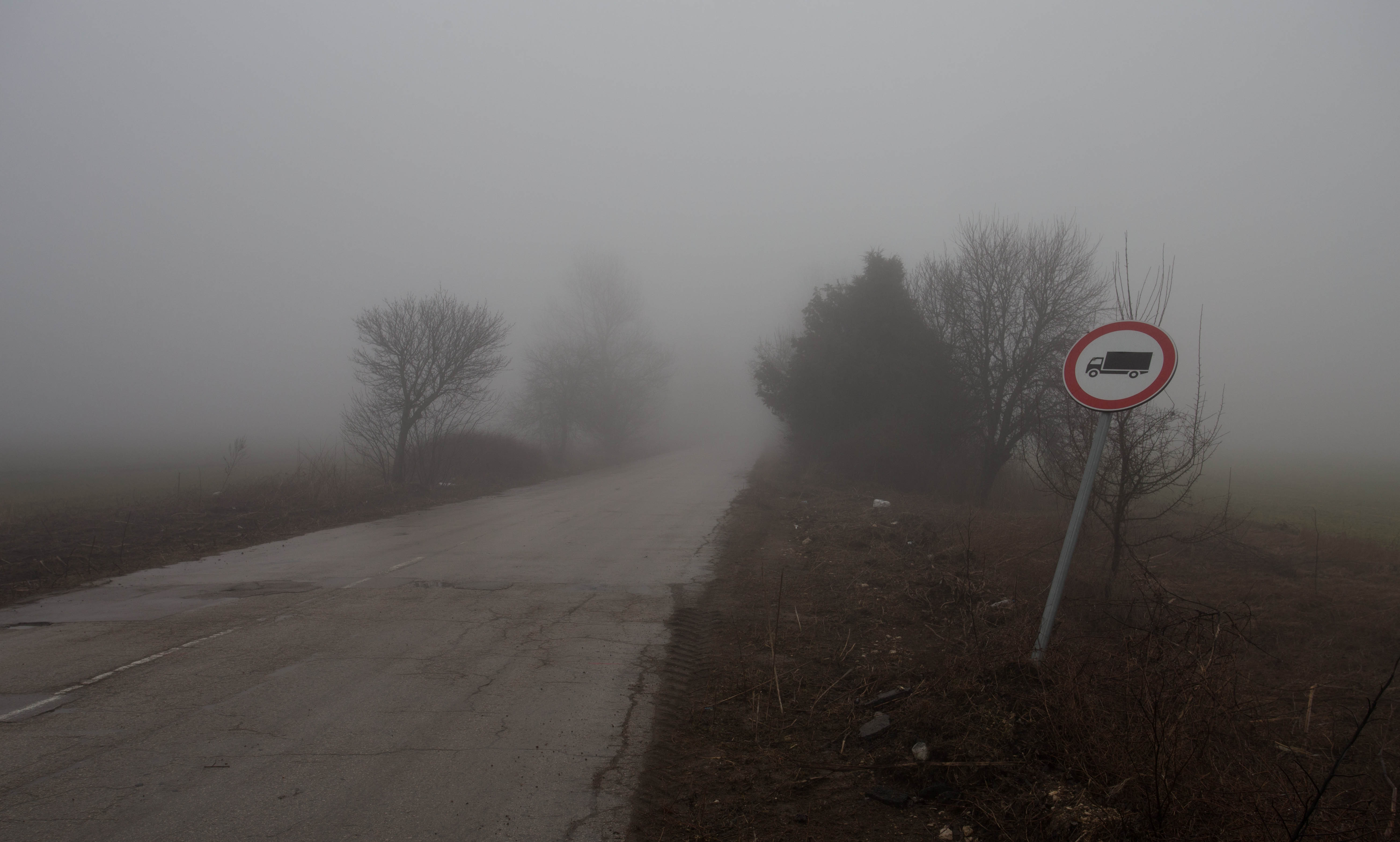 Finally reaching the turn-off from the dangerous road where I was able to pedal into the silent, misty forested hills