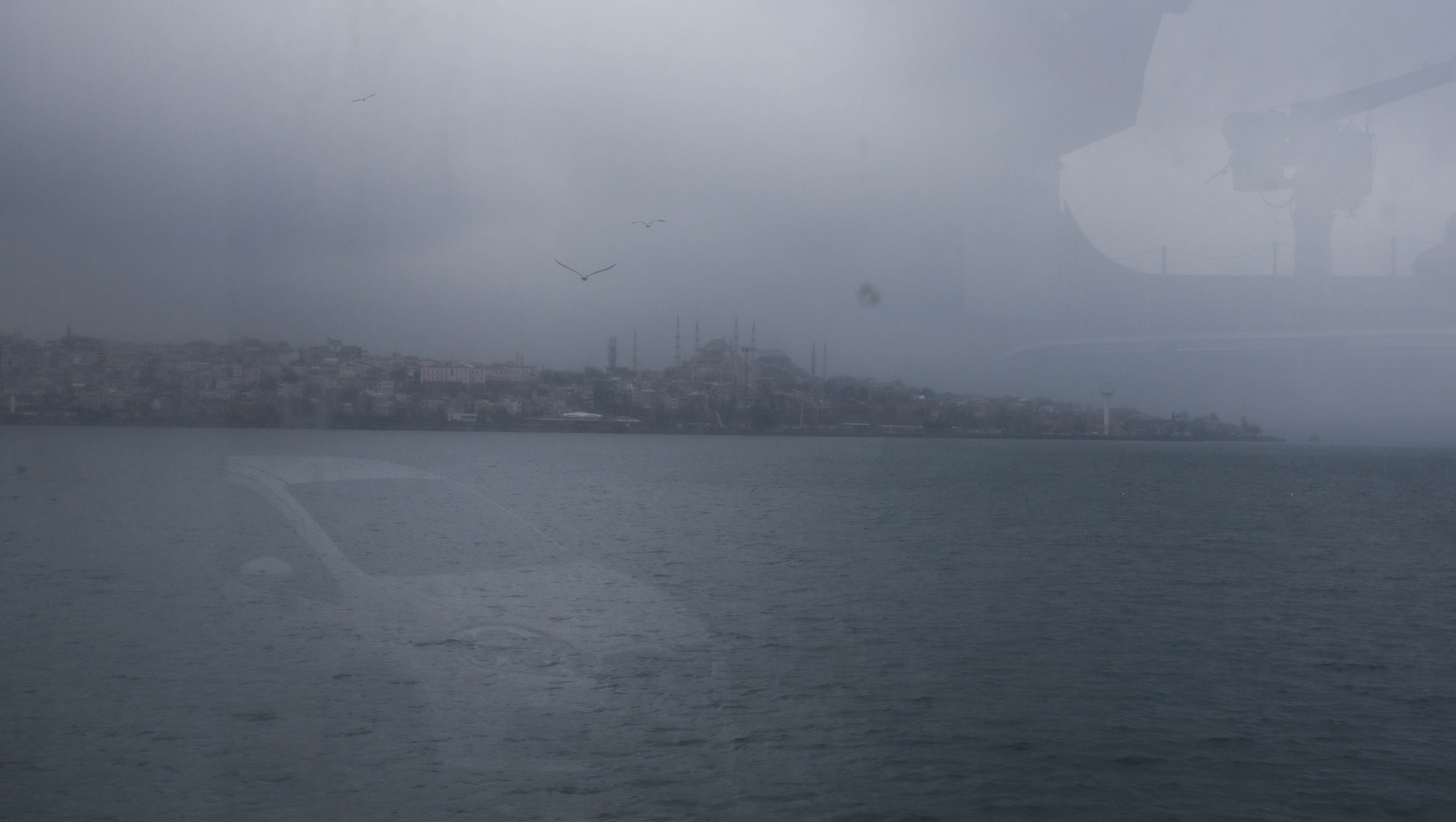 Looking out at Istanbul and Europe disappearing in the mist from my ledge on the outside deck of the car ferry