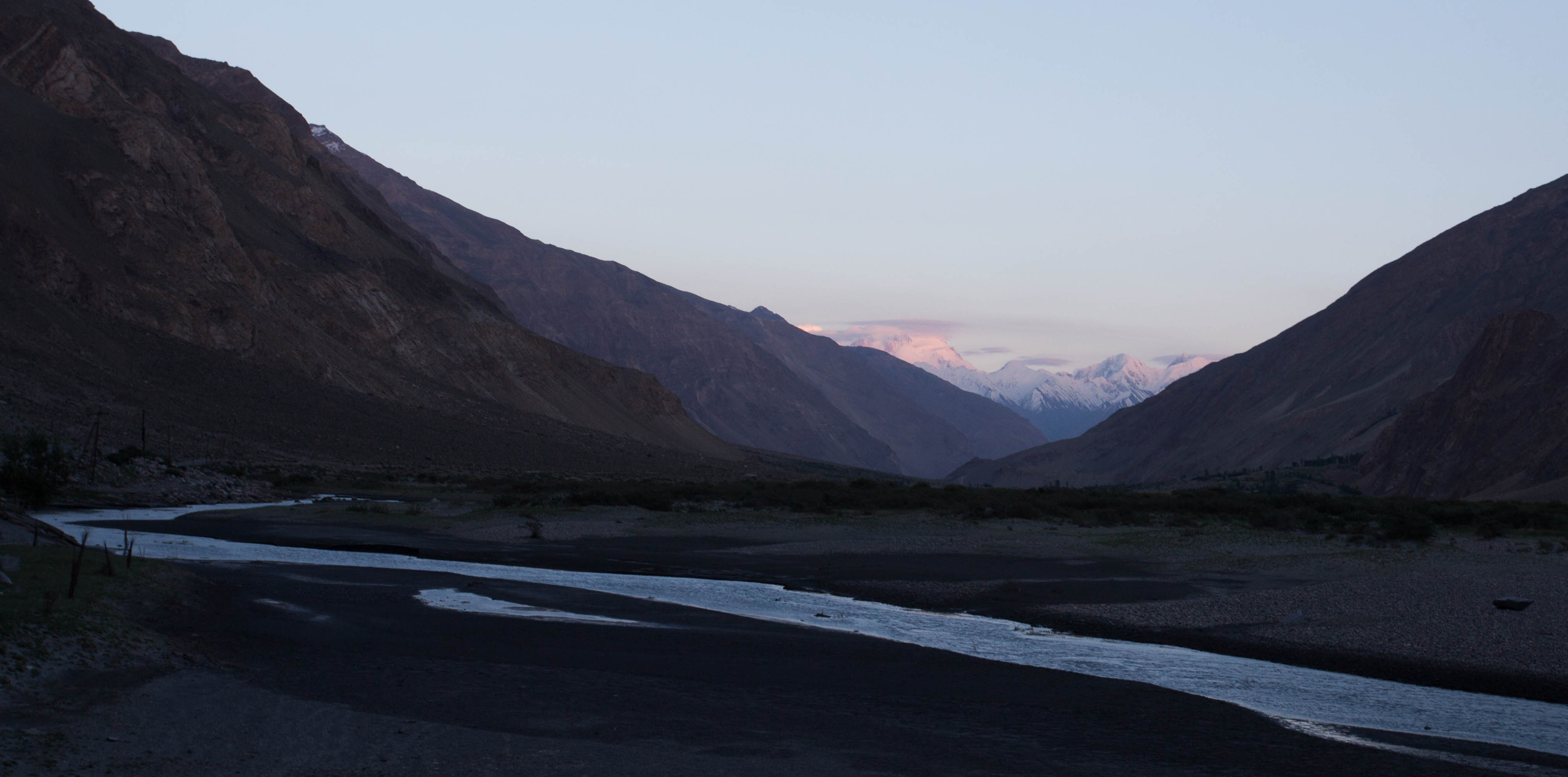 Turning a corner to be welcomed by the mighty sight of the snow-capped Hindu Kush for the first time