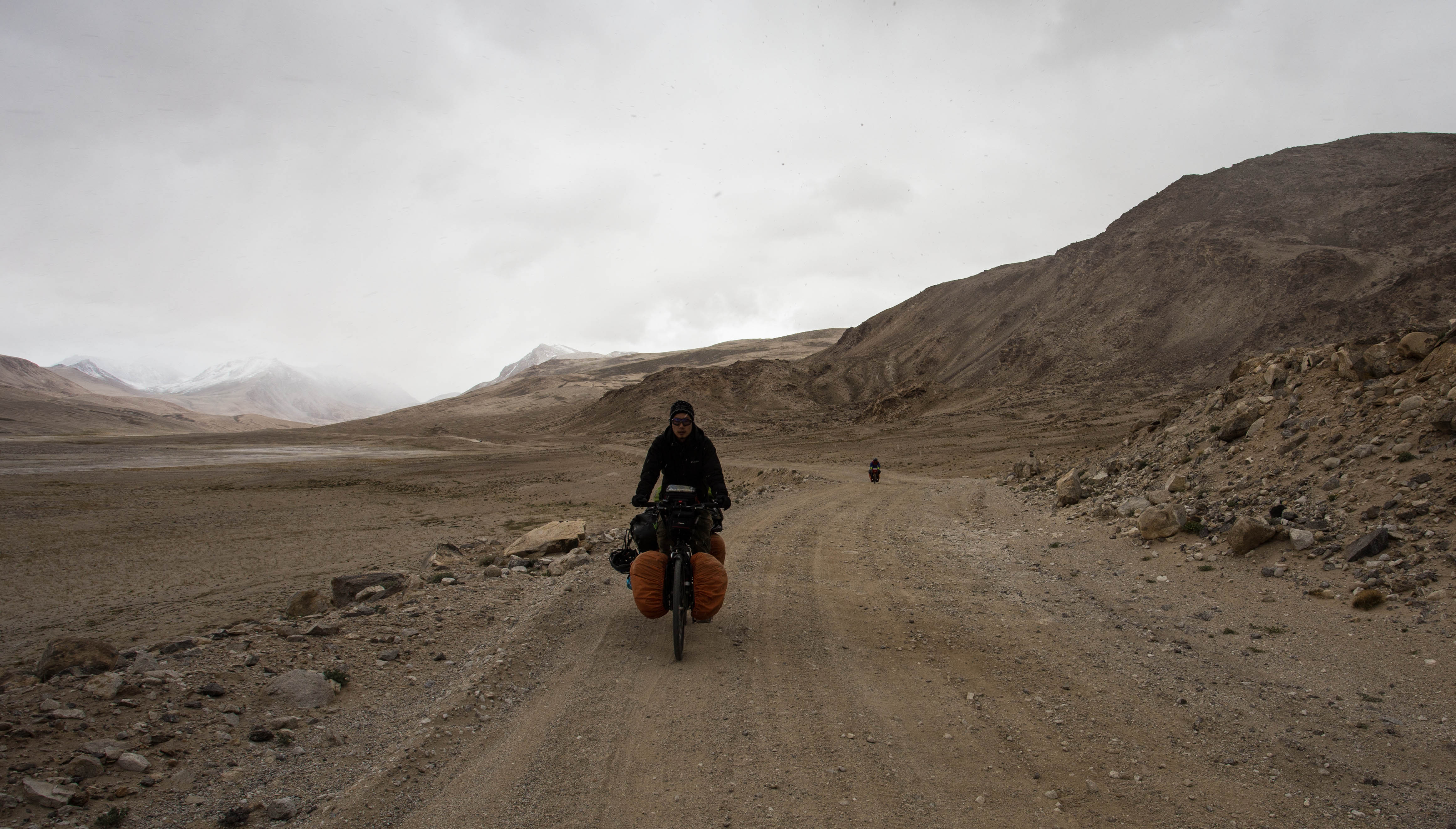 Kim and Mark descending the last, rough section of the Khargush Pass before joining the smooth tarmac of the Pamir Highway