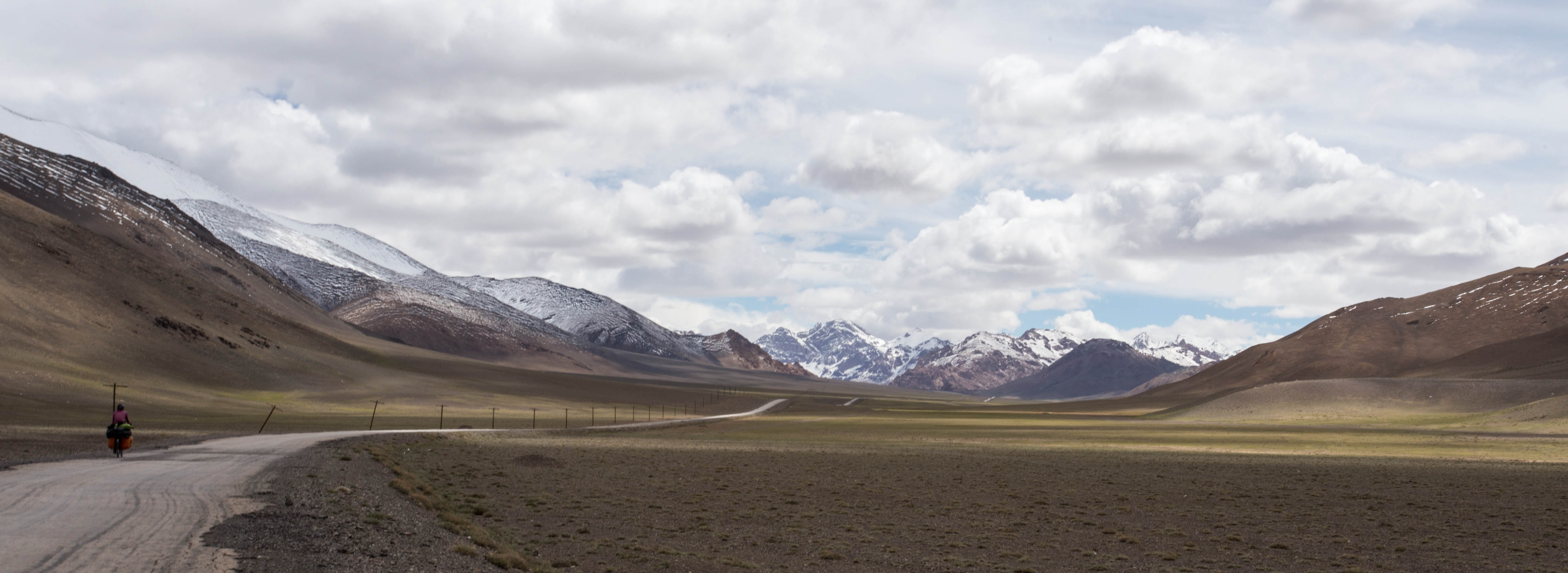 Kim with the Pamir Highway stretching away into the distance