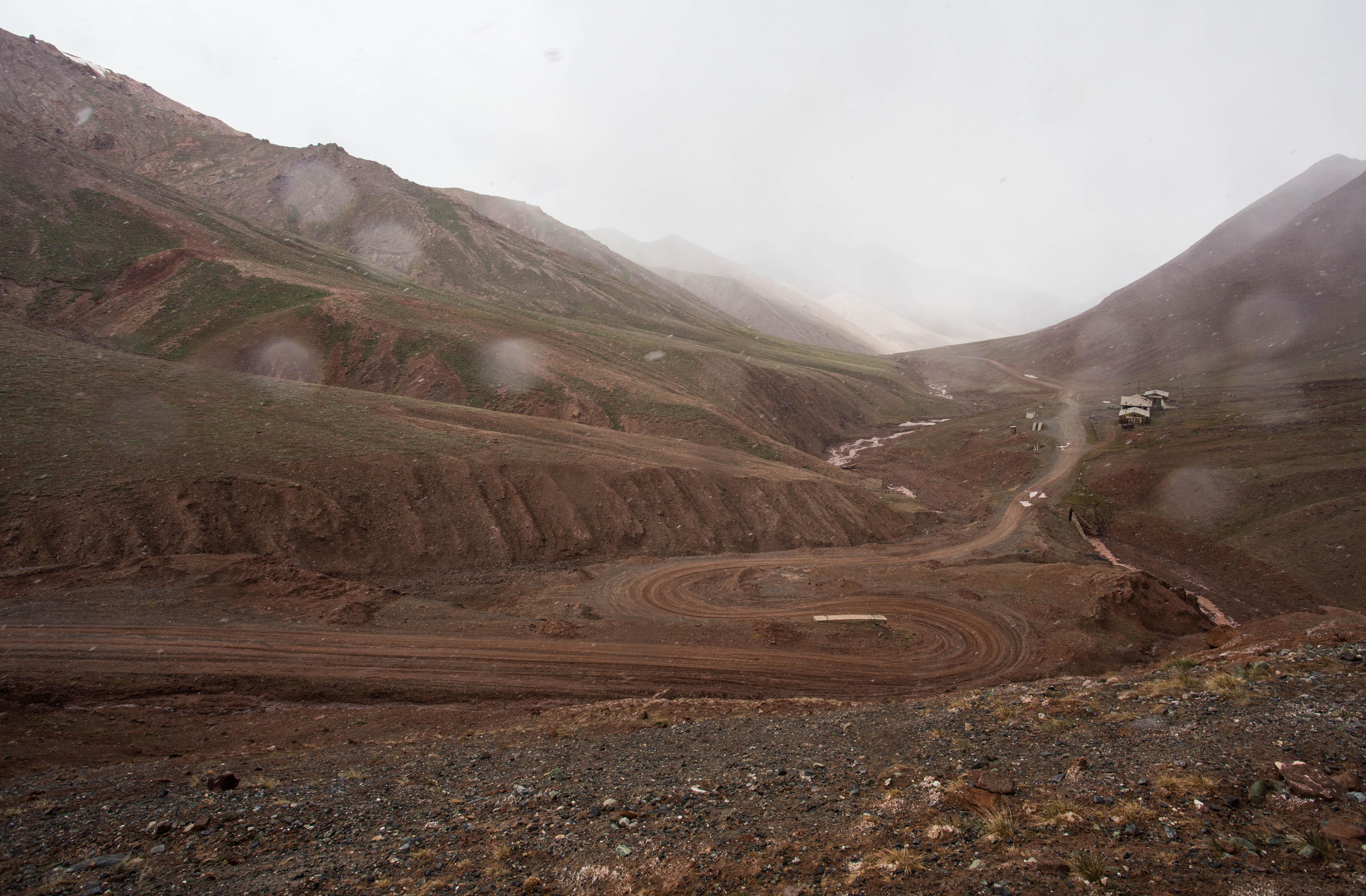 Descending through rain and mud on our way down the far side of the Kyzyl-Art pass