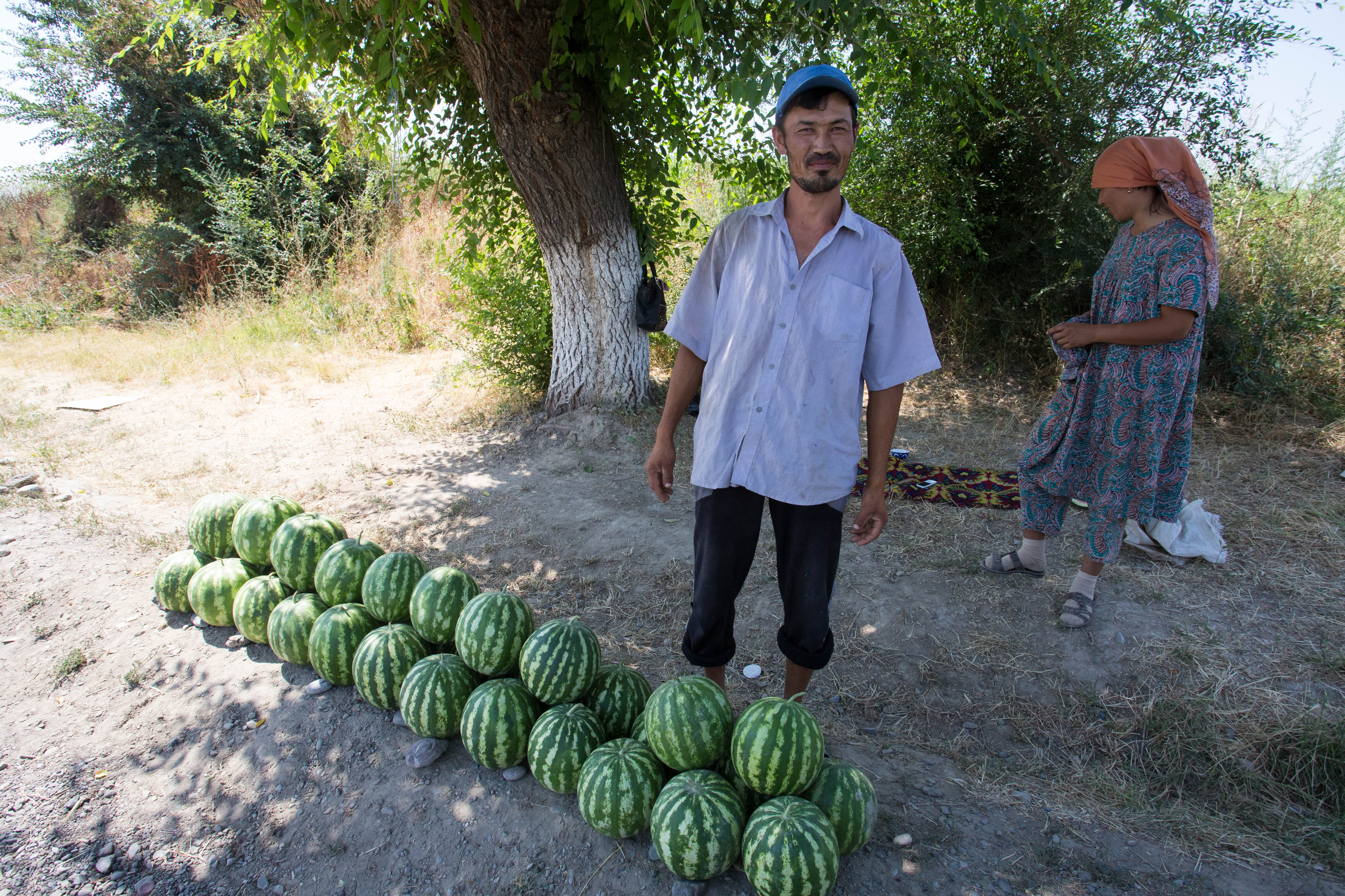 A friendly roadside watermelon vendor who waved us down and invited us to eat and chat with him