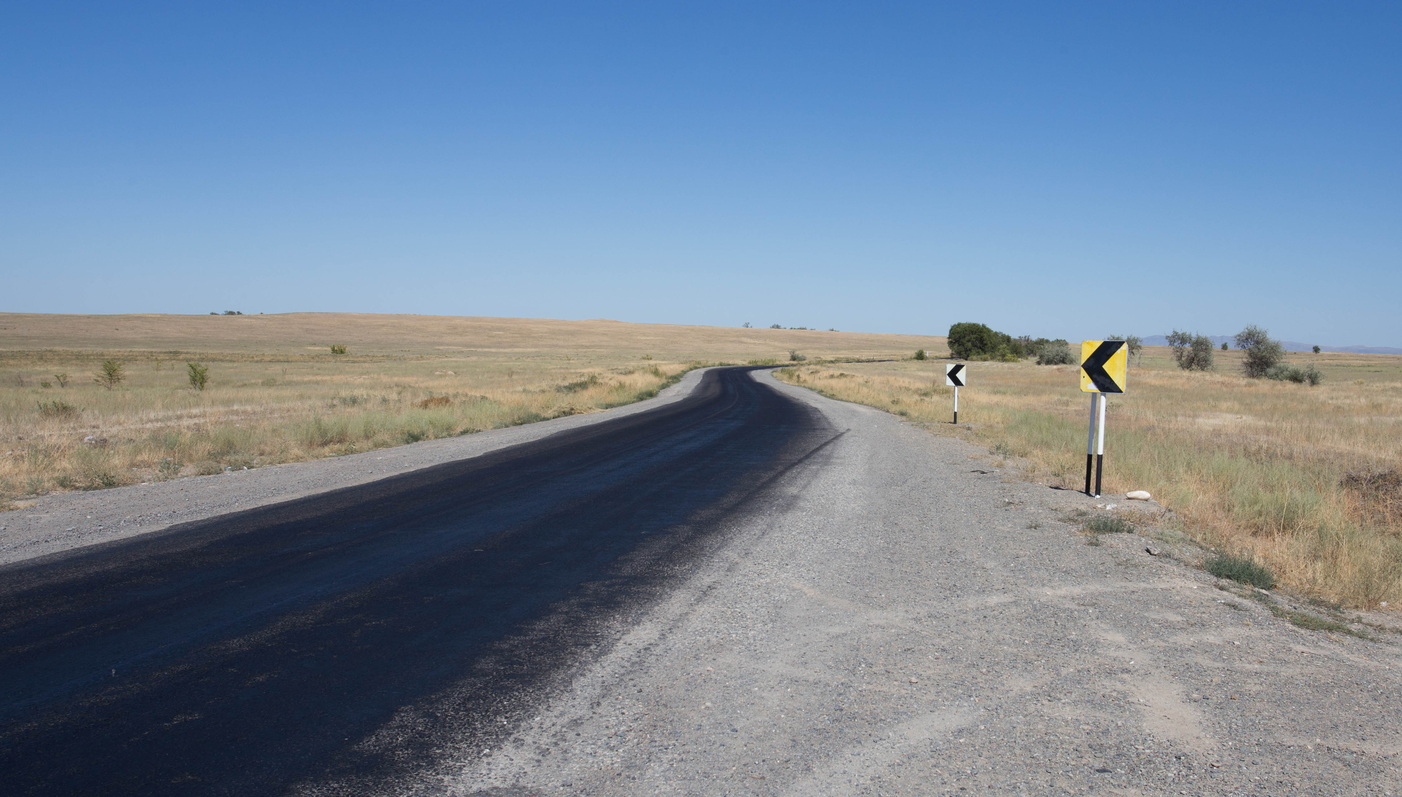 The summer heat of the Kazakh steppe would sometimes cause the tarmac road to start melting
