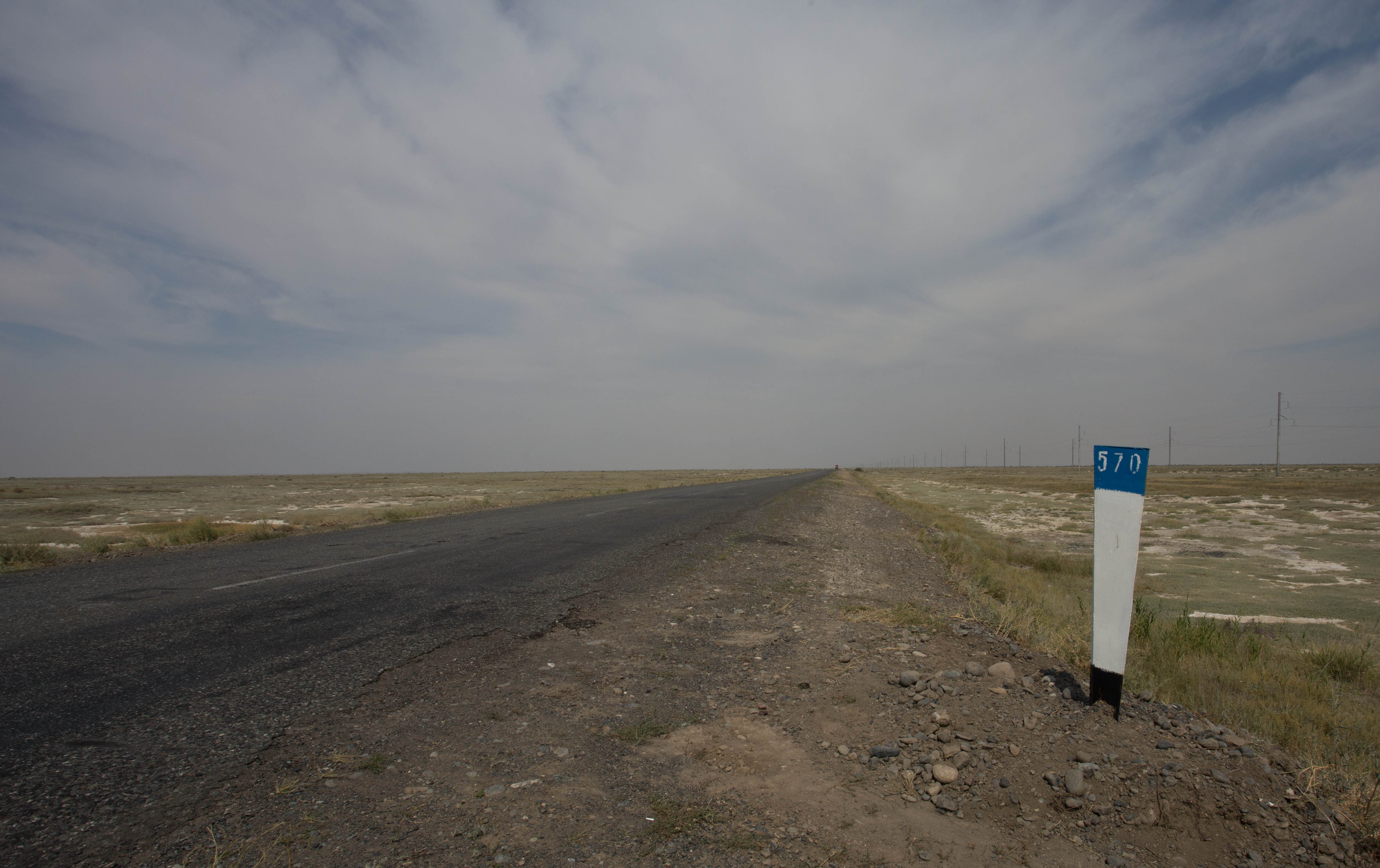 These kilometre markers broke up the monotony, showing how far I had pedalled out into the nothingness of this steppe