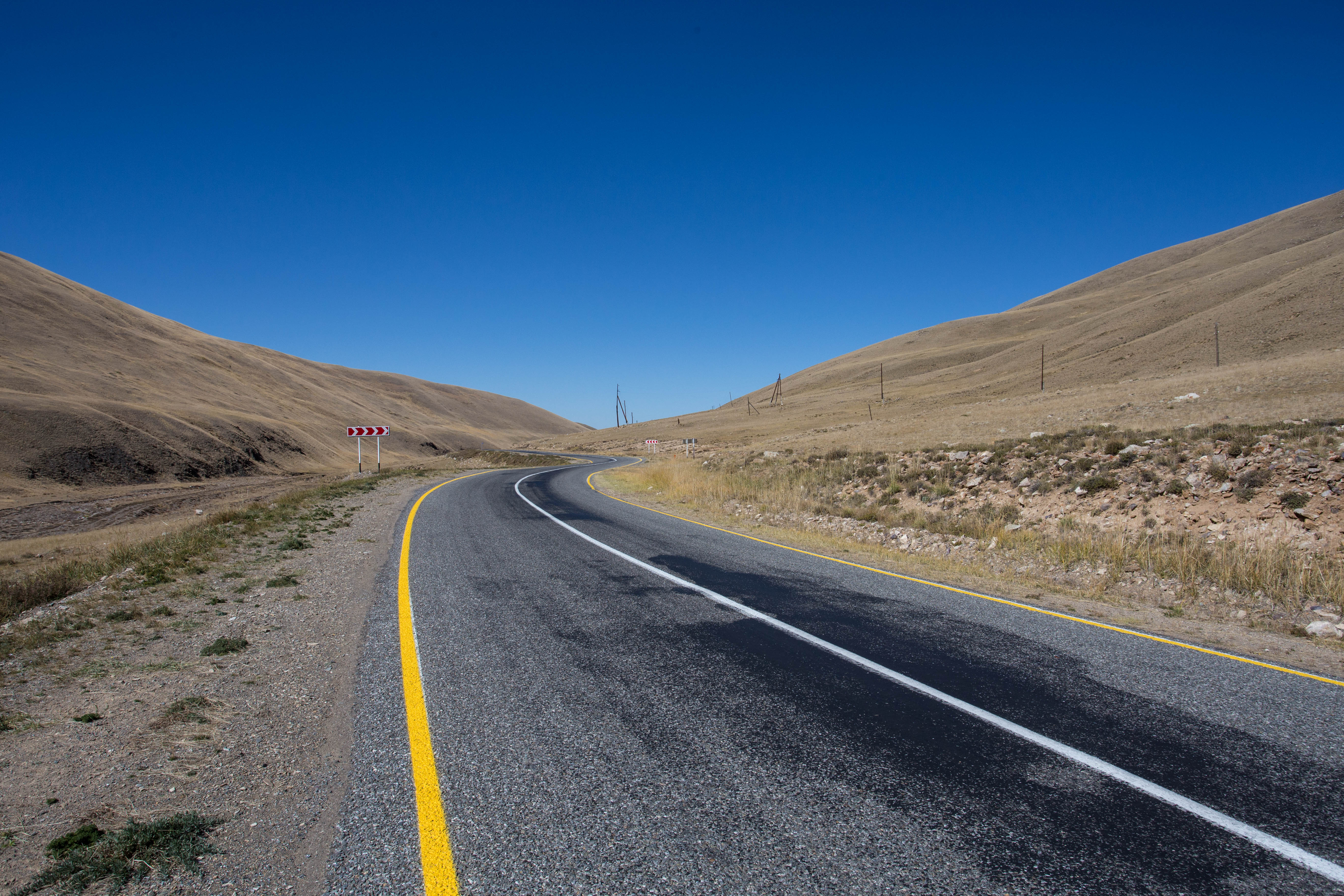 The perfect tarmac road cutting through no man's land between Russia and Mongolia