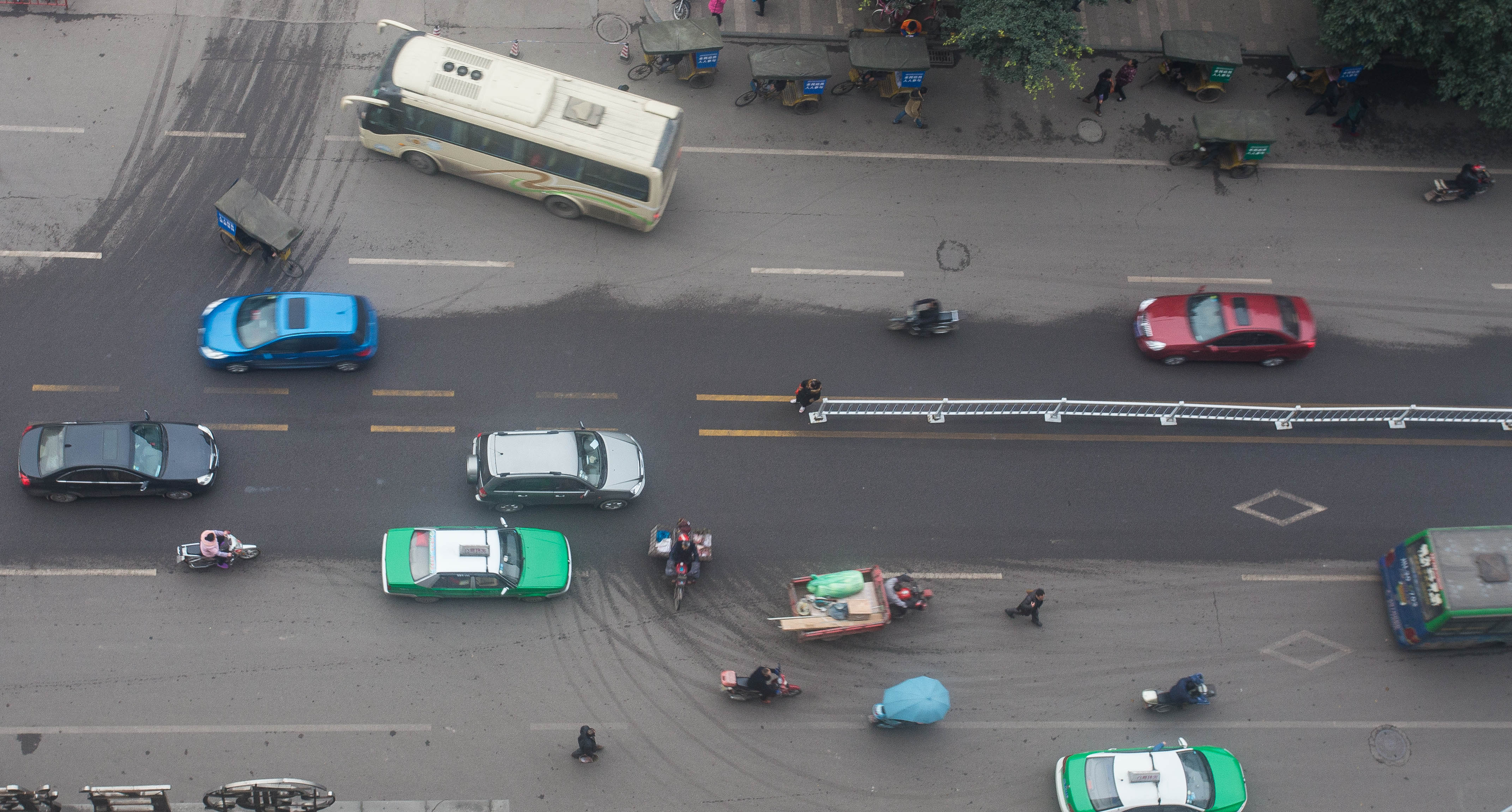A bird's eye view of the typical mayhem at a minor Chinese road junction. I spot at least three accidents waiting to happen here.