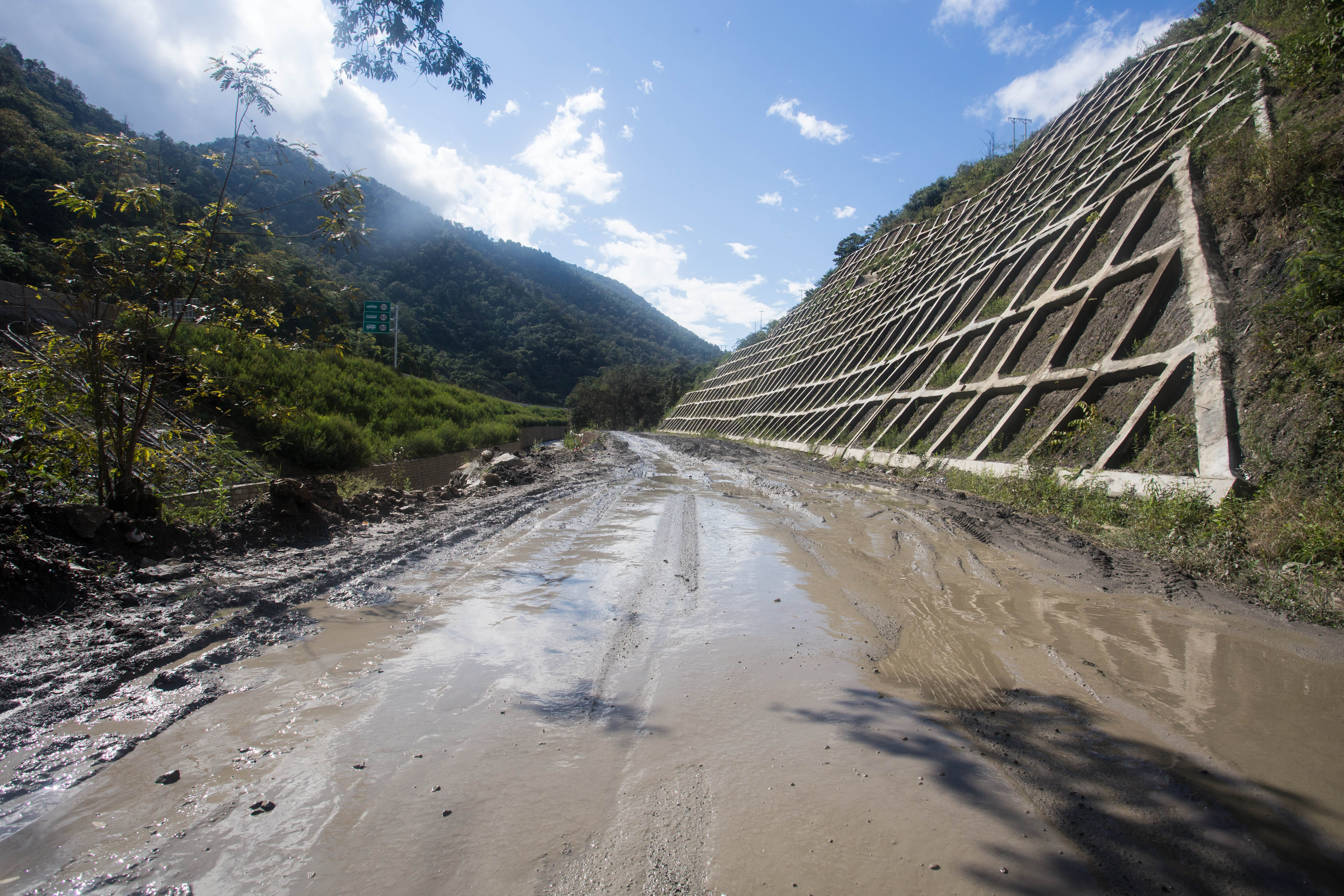 The Chinese road builders had left this, the only non-expressway road through this region, in a terrible state