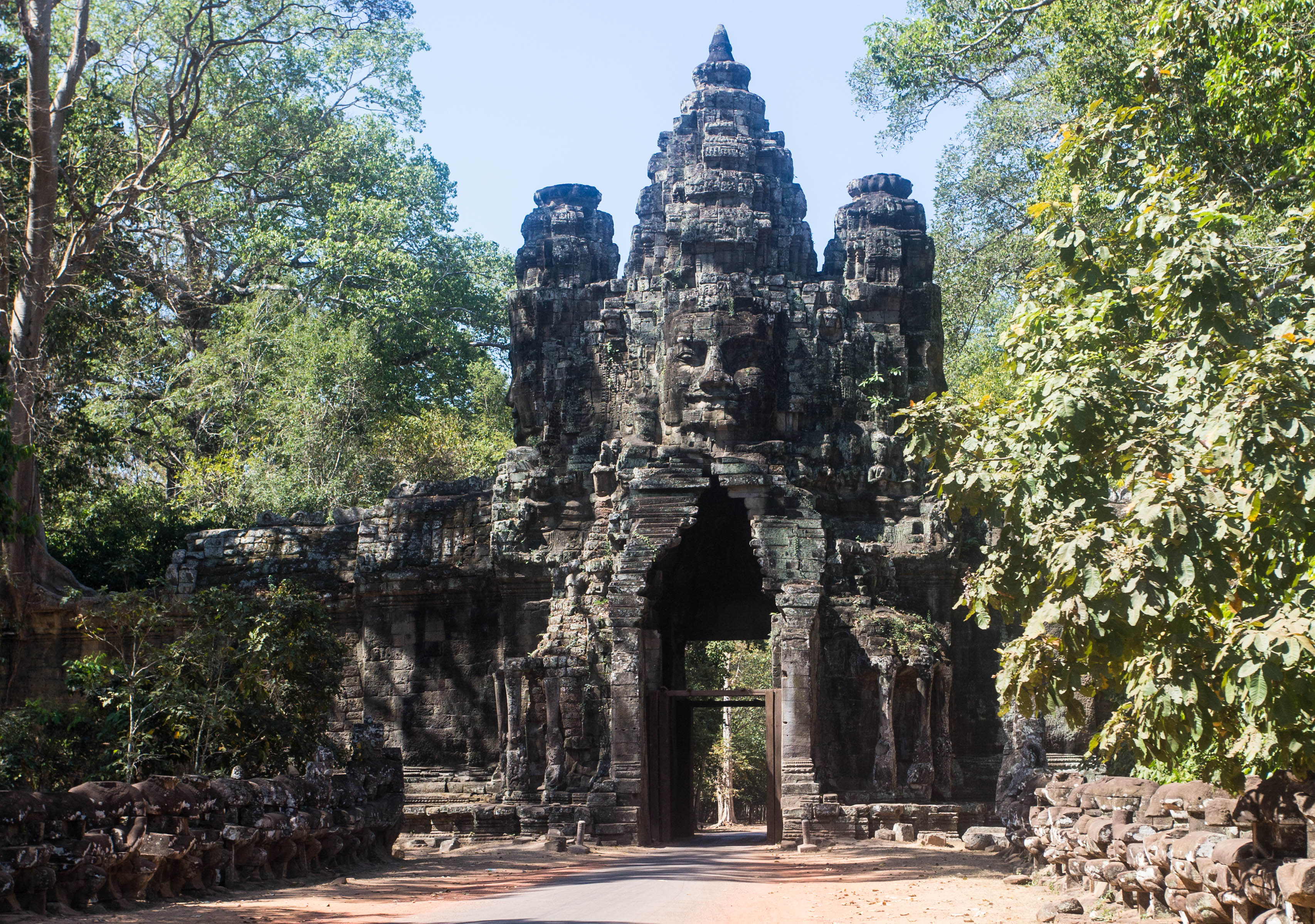 One of the main roads through Angkor Way passing through an ancient gateway