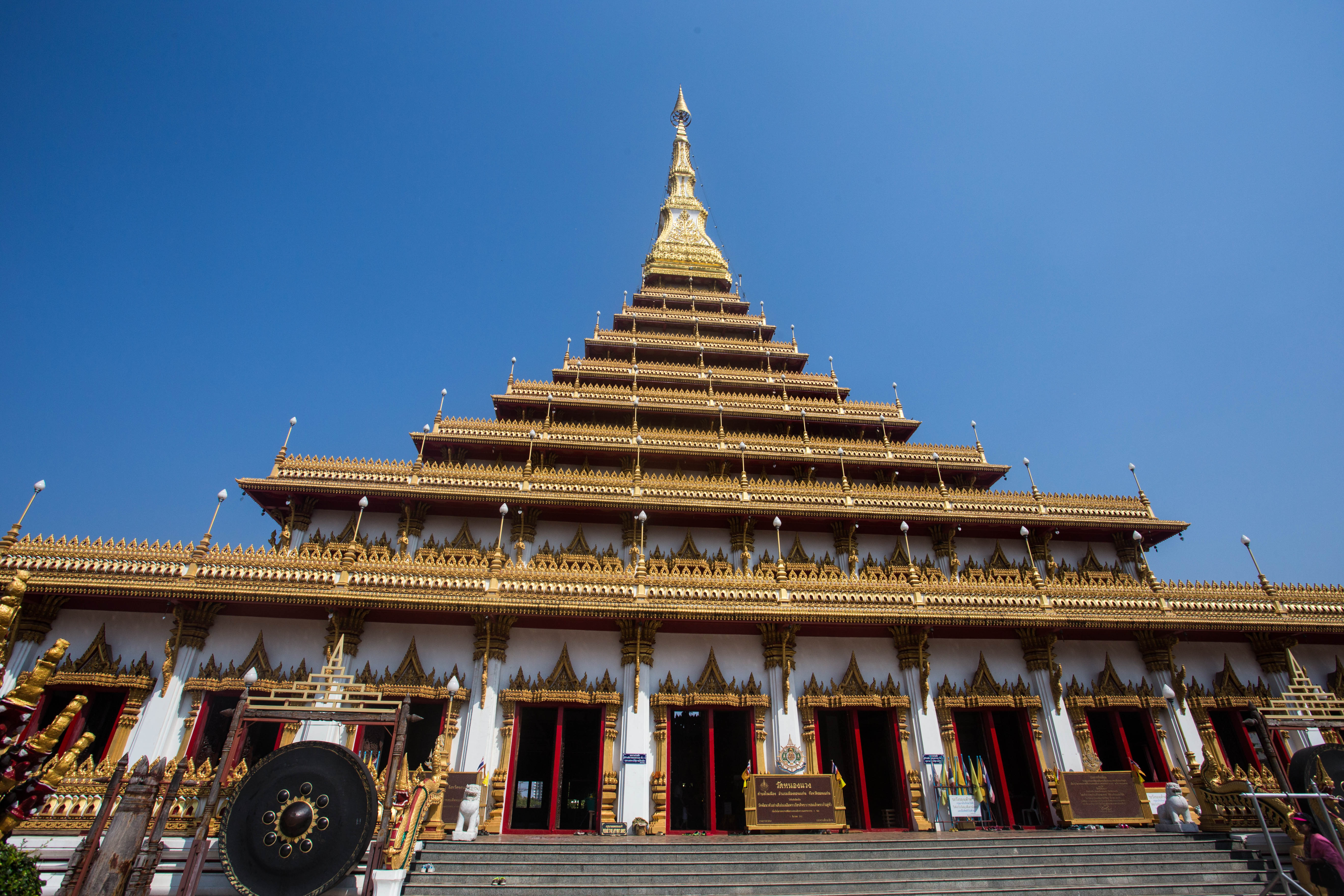 Looking up at the nine levels of the golden Wat Nong Wang Temple in Khon Kaen