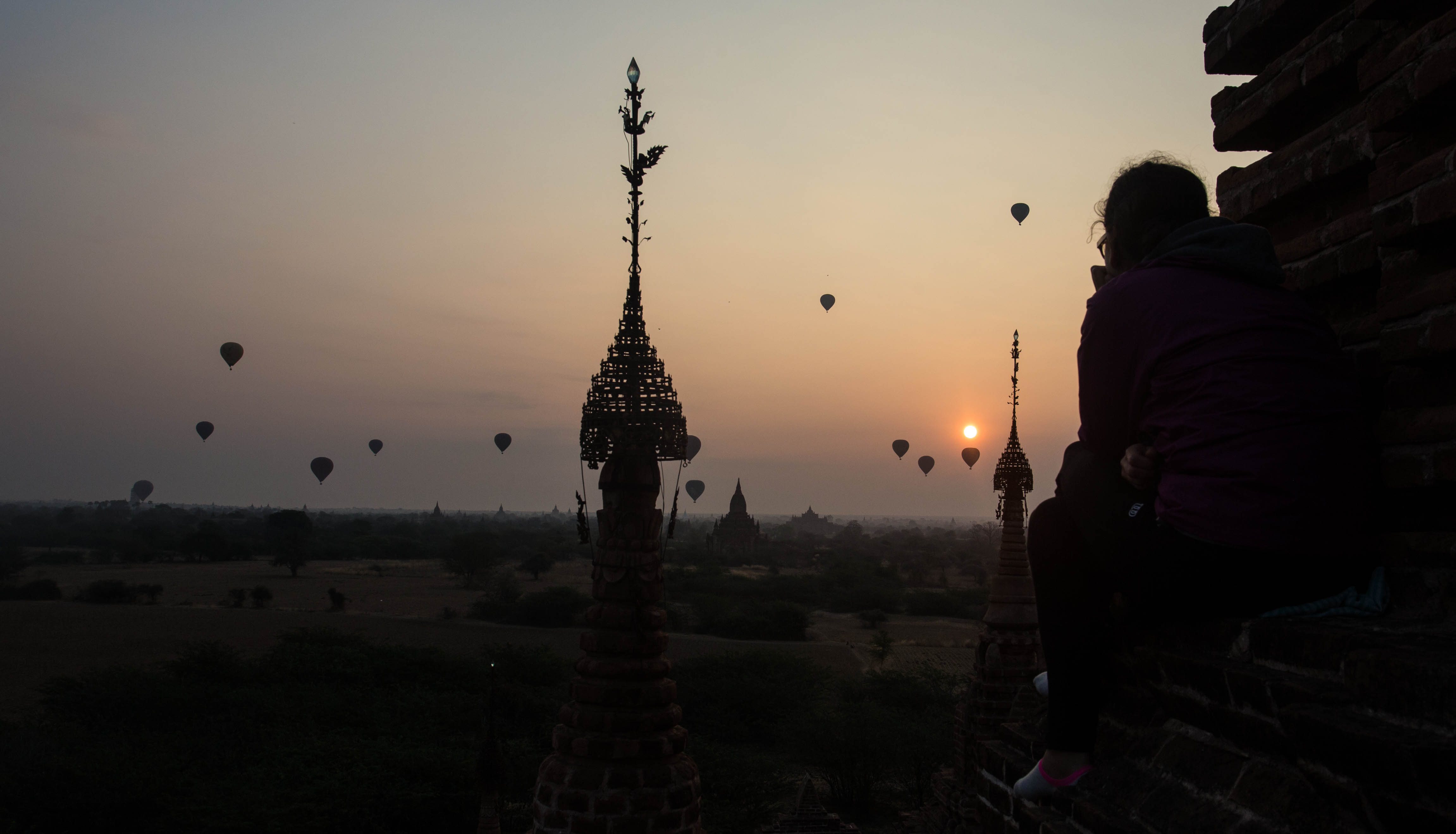 Clara, one of the backpackers admiring the exceptional view as hot-air balloons began to rise into the sky with the sun