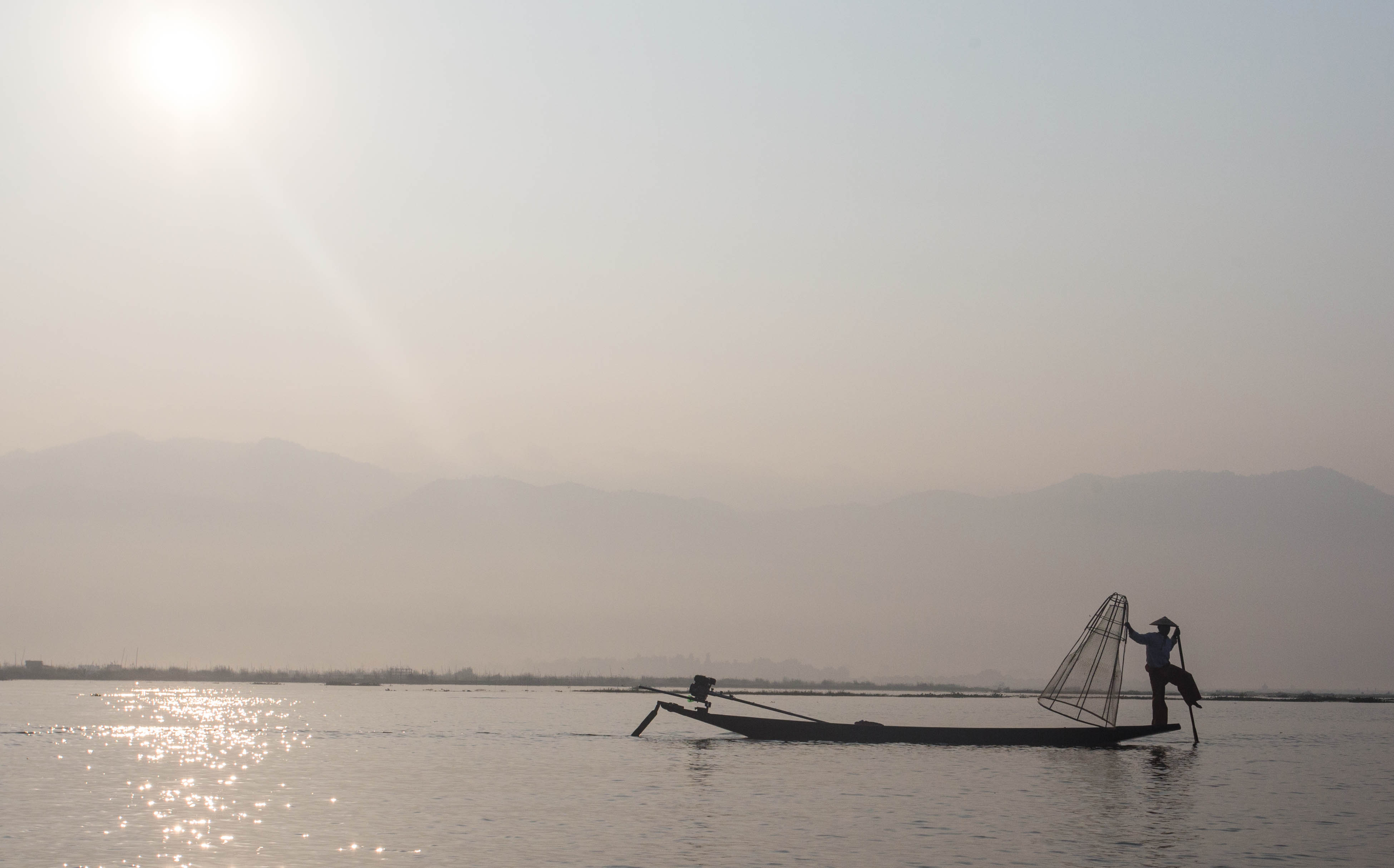 The unique method of rowing on Myanmar's Inle Lake which involves fishermen wrapping a leg around their oar. I'd like to say this was authentic, but the area has become so heavily touristed that they now actually pose for passing tourist boats!
