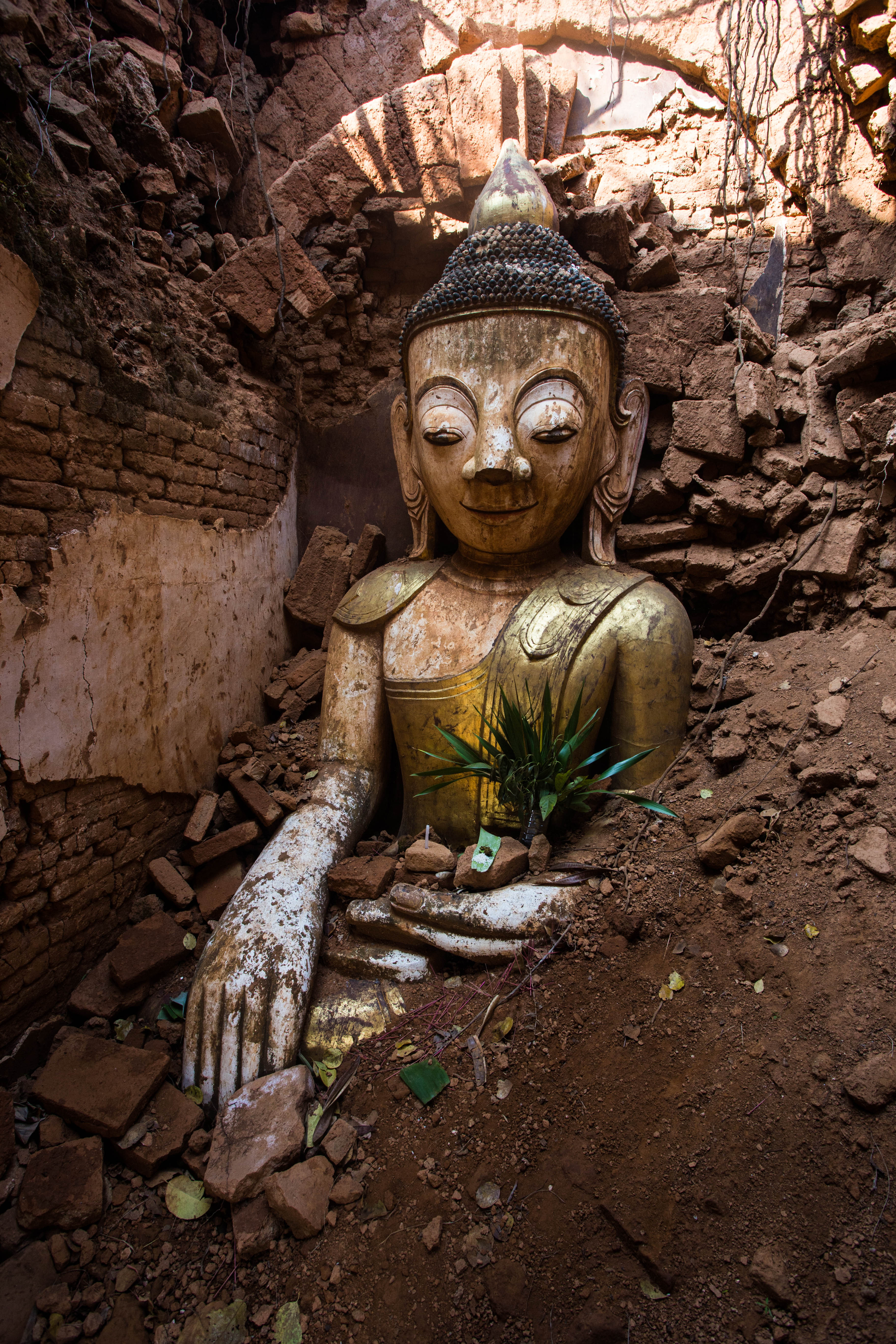 These ruins had not been restored in the same fashion as Bagan, making for some interesting buried statues in their crumbling halls